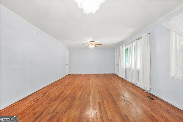119 Blount St, Forsyth, GA 31029 - unfurnished room featuring wood finished floors, ceiling fan, ornamental molding, and a chandelier