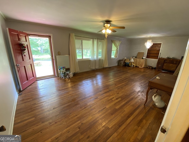 unfurnished living room featuring wood finished floors, a ceiling fan, and ornamental molding
