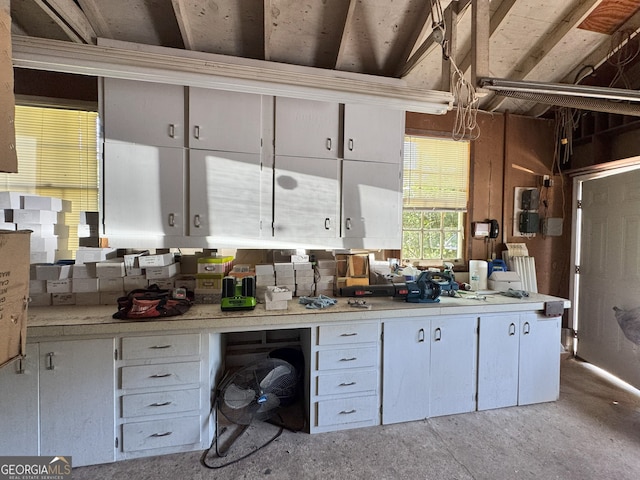 kitchen with white cabinetry and light countertops