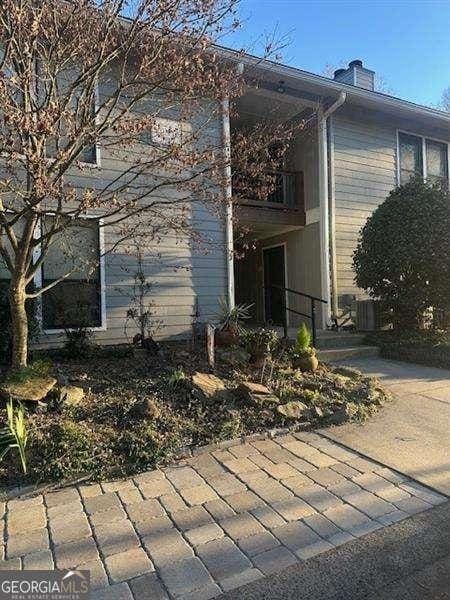 506 Park Ridge Cir, Marietta, GA 30068 - view of side of property with a balcony and a chimney