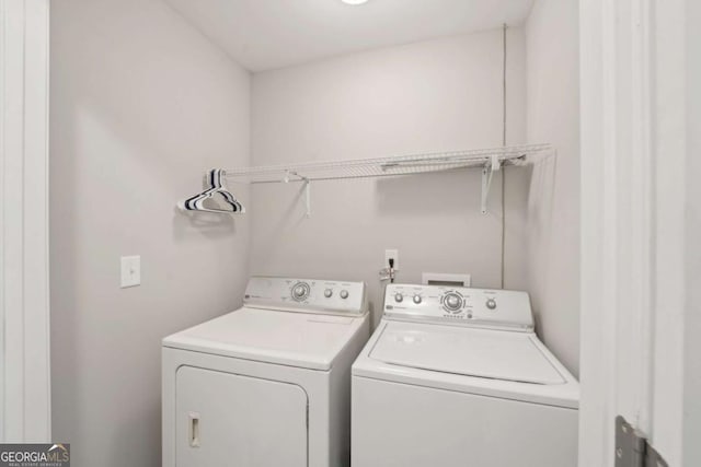 laundry room with washer and dryer