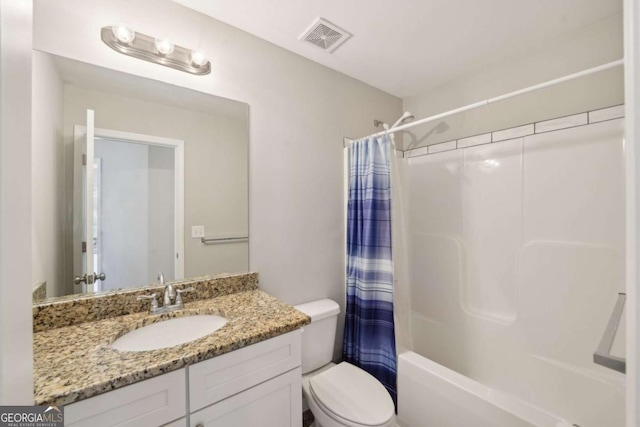 bathroom with vanity, toilet, shower / tub combo, and visible vents