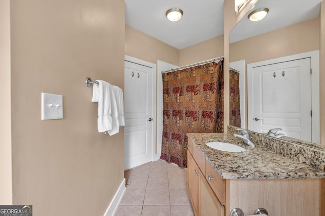 full bathroom with baseboards, a shower with curtain, tile patterned floors, and vanity