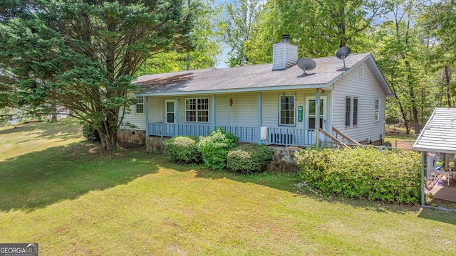 303 Jennys Cove Rd, Cleveland, GA 30528 - view of front of home featuring a front lawn, a porch, roof with shingles, and a chimney