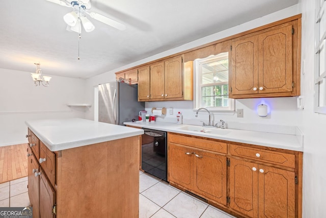 303 Jennys Cove Rd, Cleveland, GA 30528 - kitchen with black dishwasher, a sink, light tile patterned flooring, and brown cabinets