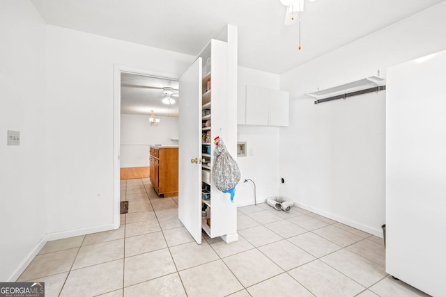 303 Jennys Cove Rd, Cleveland, GA 30528 - laundry room with ceiling fan, cabinet space, baseboards, and light tile patterned floors