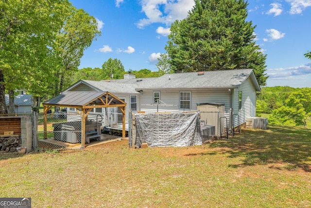 303 Jennys Cove Rd, Cleveland, GA 30528 - rear view of house featuring a yard, central AC unit, fence, and a carport
