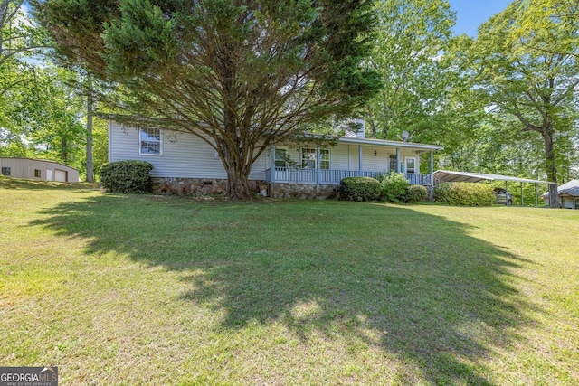 303 Jennys Cove Rd, Cleveland, GA 30528 - view of grassy yard featuring covered porch and an outbuilding