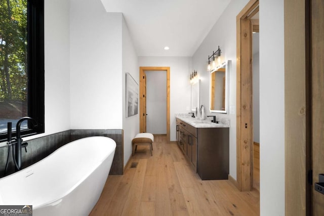 714 Scouts Overlook, Morganton, GA 30560 - bathroom featuring a freestanding bath, recessed lighting, vanity, and wood-type flooring