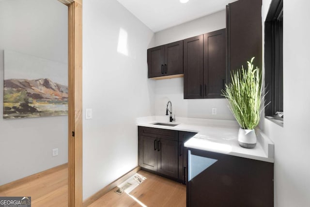 714 Scouts Overlook, Morganton, GA 30560 - bar with baseboards, light wood-style flooring, and a sink