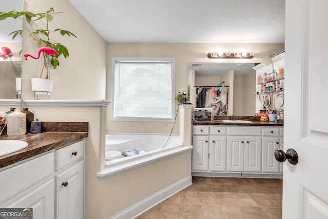 1553 Shoal Creek Dr, Winder, GA 30680 - full bathroom featuring two vanities, a bath, a shower with curtain, and tile patterned flooring