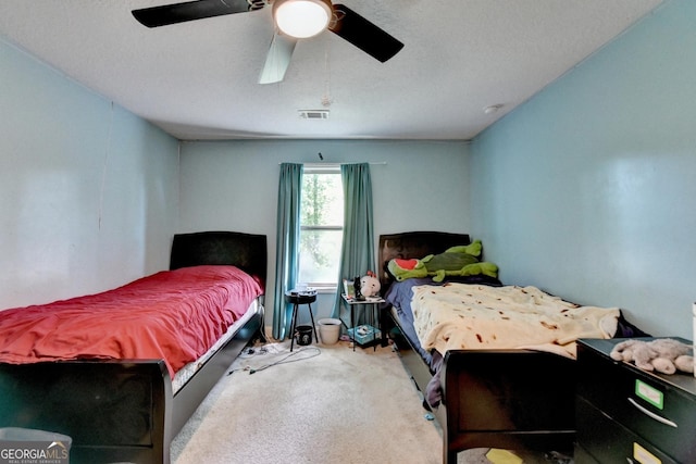 bedroom featuring carpet and a ceiling fan