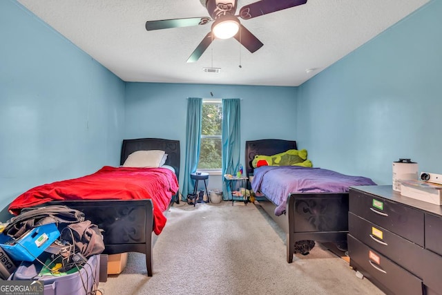 1553 Shoal Creek Dr, Winder, GA 30680 - carpeted bedroom featuring a textured ceiling and ceiling fan