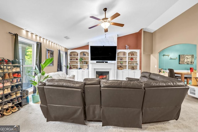 1553 Shoal Creek Dr, Winder, GA 30680 - living area featuring a ceiling fan, a fireplace, carpet, and lofted ceiling