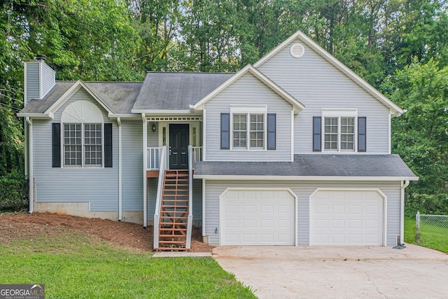 2326 Westland Way, Acworth, GA 30102 - view of front of property with a garage, stairway, concrete driveway, a chimney, and view of wooded area