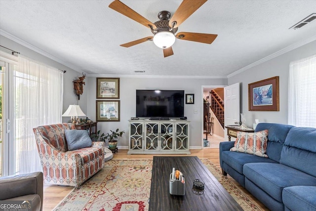 540 Commanche Dr, Macon, GA 31210 - living room featuring stairs, plenty of natural light, and wood finished floors