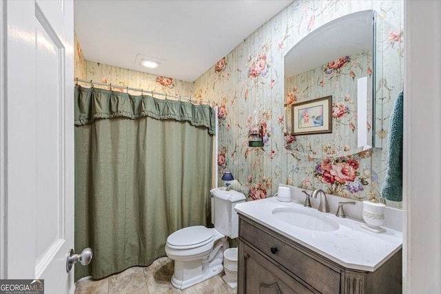 540 Commanche Dr, Macon, GA 31210 - full bathroom featuring toilet, tile patterned floors, vanity, and wallpapered walls