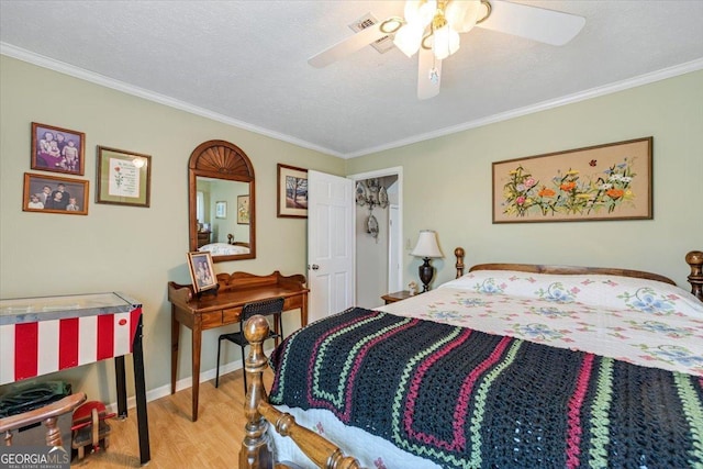 540 Commanche Dr, Macon, GA 31210 - bedroom with wood finished floors, visible vents, crown molding, ceiling fan, and baseboards