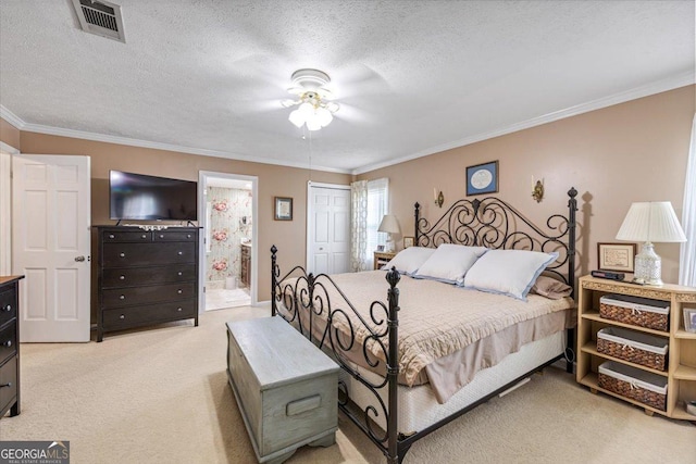 540 Commanche Dr, Macon, GA 31210 - bedroom with light colored carpet, crown molding, ensuite bath, and visible vents