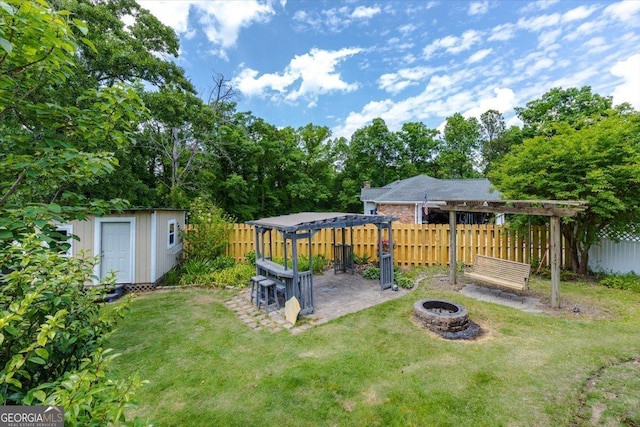 540 Commanche Dr, Macon, GA 31210 - view of yard with fence, an outdoor structure, a patio, a pergola, and an outdoor fire pit