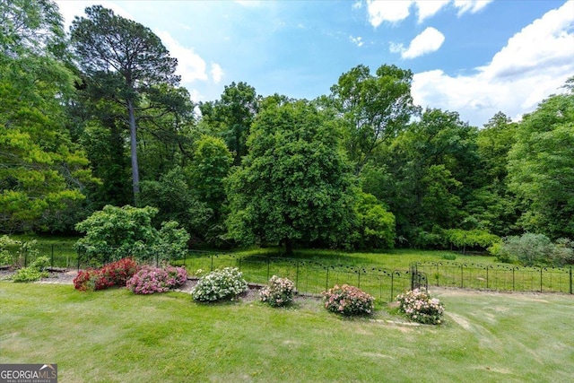540 Commanche Dr, Macon, GA 31210 - view of yard featuring a wooded view and fence