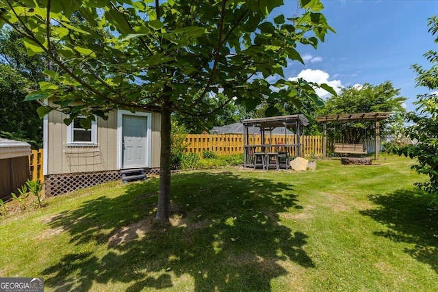 540 Commanche Dr, Macon, GA 31210 - view of yard featuring a fenced backyard, a shed, and an outbuilding