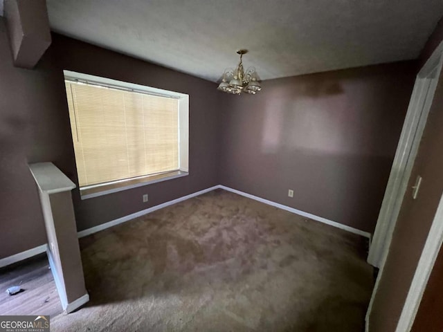 2572 Stratford Ln, Morrow, GA 30260 - unfurnished dining area featuring baseboards, an inviting chandelier, and carpet floors