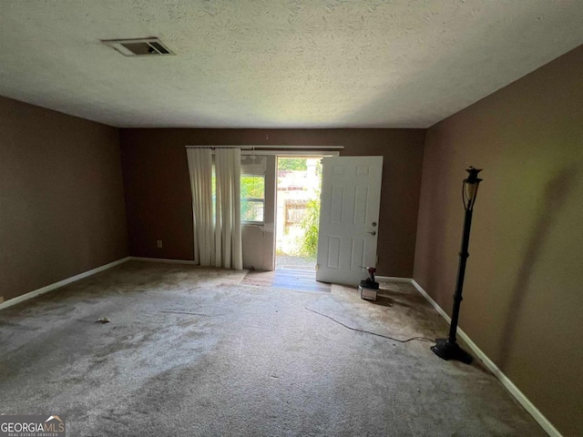 2572 Stratford Ln, Morrow, GA 30260 - carpeted empty room with a textured ceiling, visible vents, and baseboards