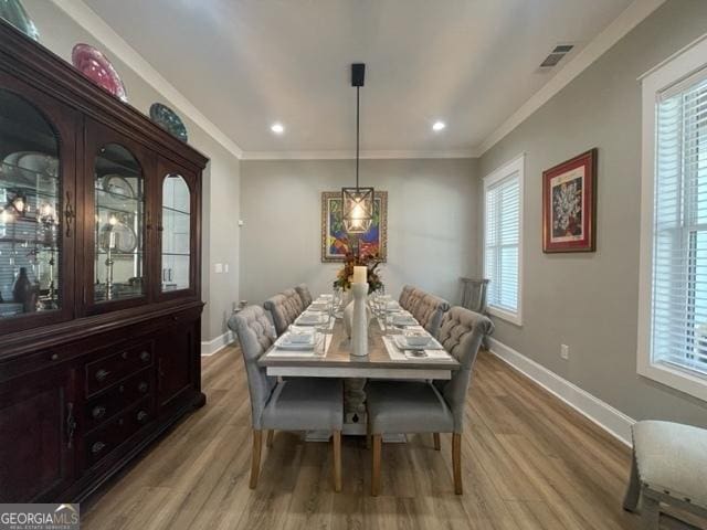 338 Grady St, Waleska, GA 30183 - dining space featuring light wood-style floors, healthy amount of natural light, recessed lighting, and crown molding