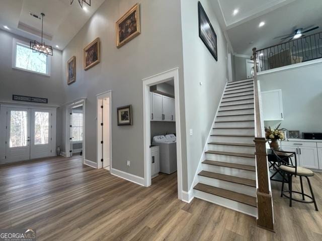338 Grady St, Waleska, GA 30183 - foyer entrance featuring a towering ceiling, wood finished floors, stairway, a chandelier, and french doors