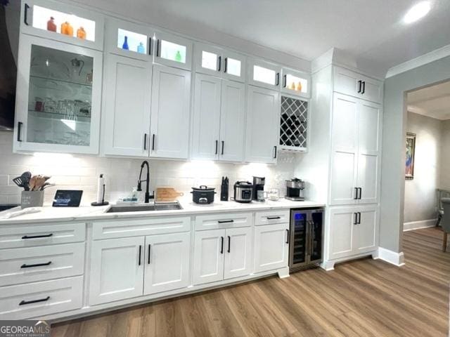 338 Grady St, Waleska, GA 30183 - indoor bar with beverage cooler, light wood-type flooring, backsplash, and ornamental molding