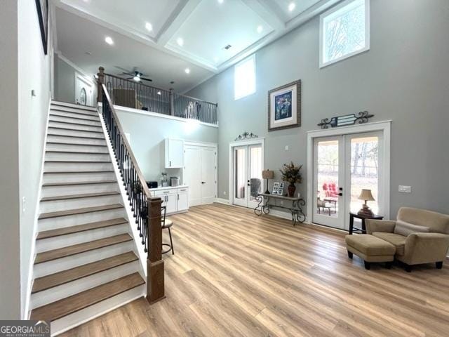 338 Grady St, Waleska, GA 30183 - foyer entrance featuring french doors, stairway, a high ceiling, a ceiling fan, and light wood finished floors