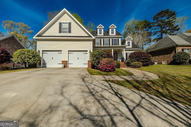 261 Providence Blvd, Macon, GA 31210 - traditional-style house featuring an attached garage, covered porch, concrete driveway, a front yard, and brick siding