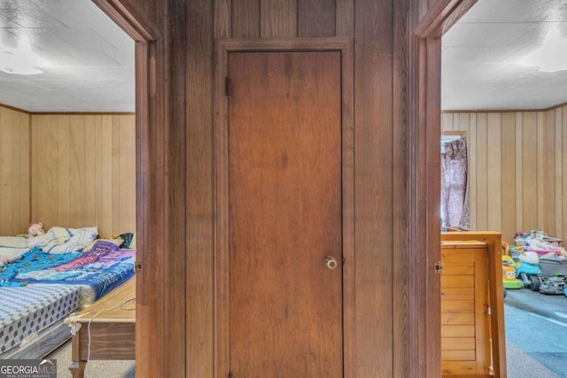 interior space featuring wood walls