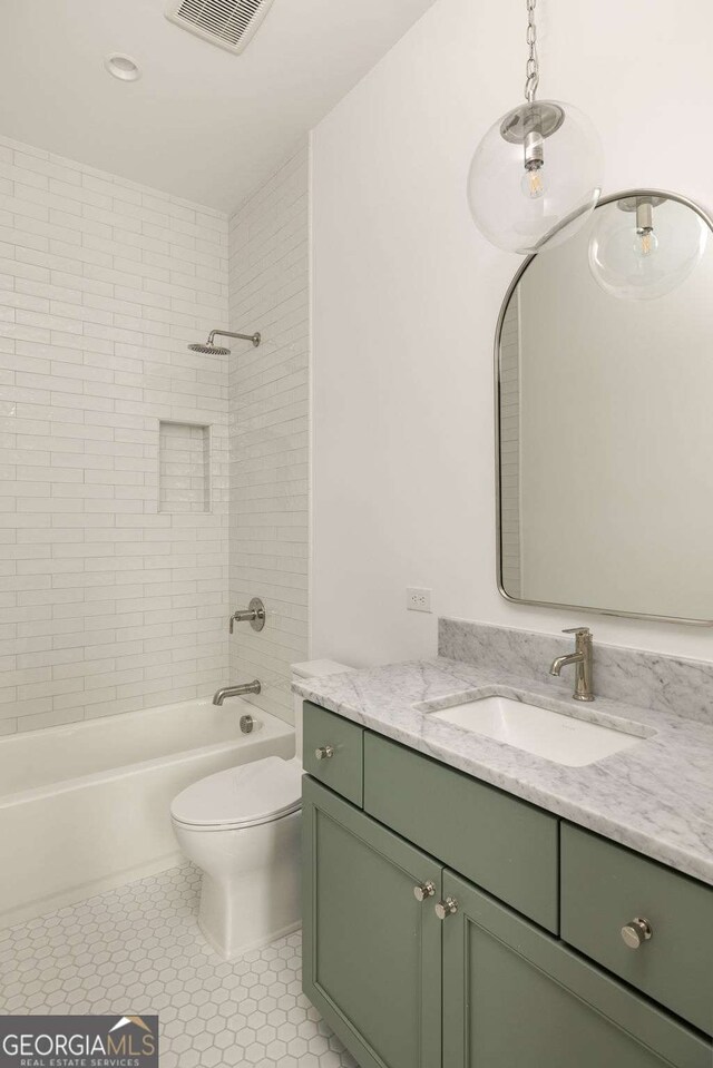 11536 Serenbe Ln, Chattahoochee Hills, GA 30268 - full bath featuring toilet, visible vents, tile patterned floors, vanity, and shower / washtub combination
