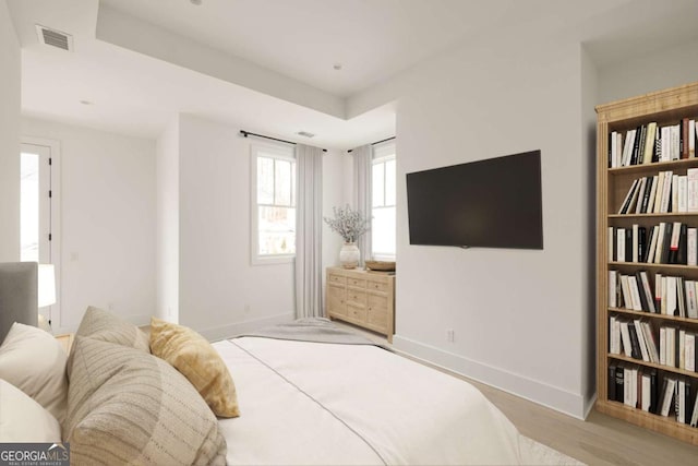 11536 Serenbe Ln, Chattahoochee Hills, GA 30268 - bedroom featuring wood finished floors, visible vents, and baseboards