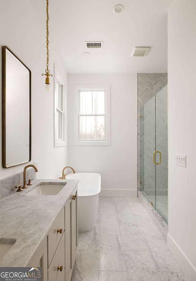 11536 Serenbe Ln, Chattahoochee Hills, GA 30268 - bathroom featuring a stall shower, baseboards, visible vents, a sink, and a soaking tub