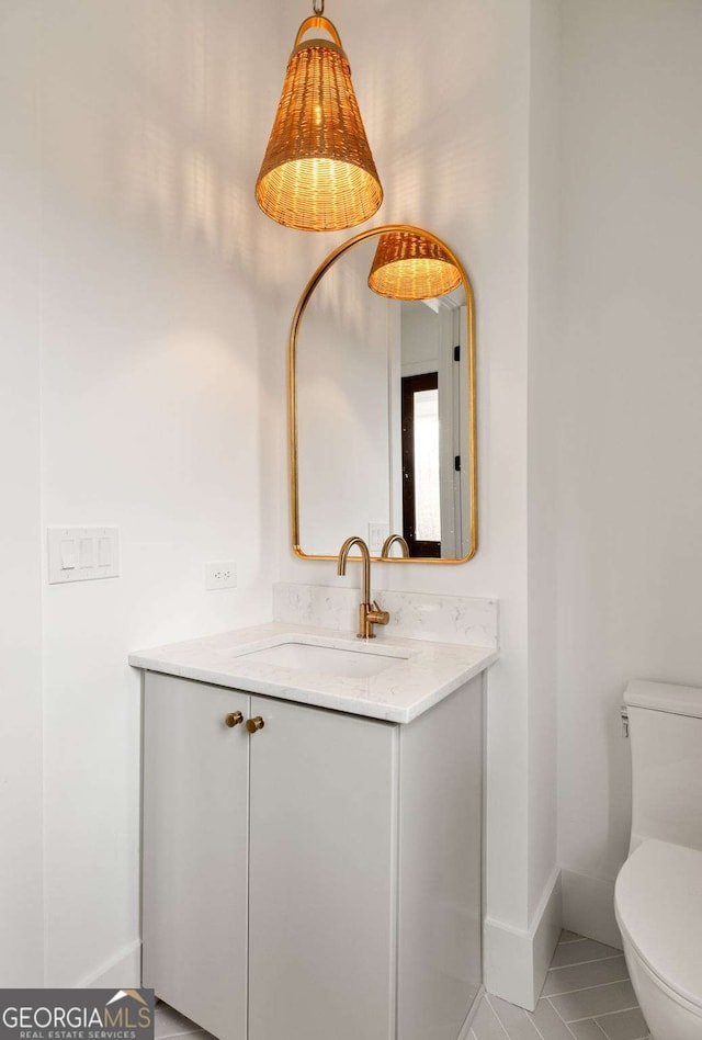 11536 Serenbe Ln, Chattahoochee Hills, GA 30268 - bathroom with toilet, tile patterned flooring, vanity, and baseboards