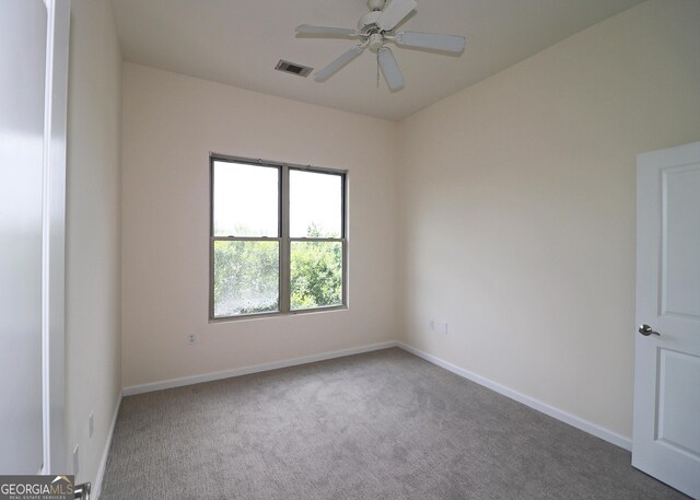 870 Mayson Turner Rd NW Unit 1447, Atlanta, GA 30314 - carpeted spare room with baseboards and ceiling fan