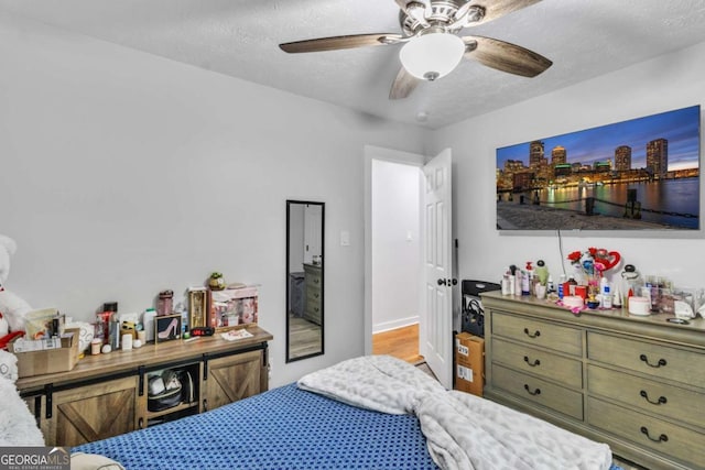 3819 Shane Ct, Ellenwood, GA 30294 - bedroom with a textured ceiling and a ceiling fan
