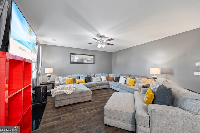 living area with wood finished floors and ceiling fan