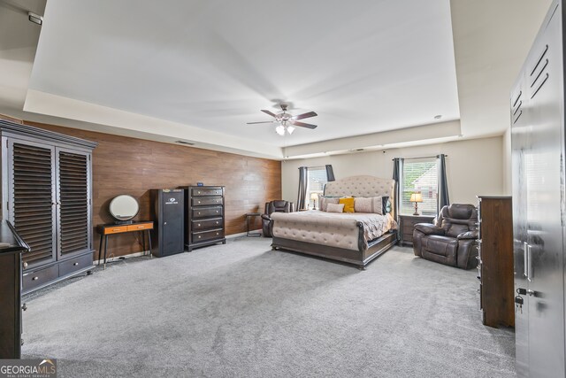 548 Azalea Bloom Dr E, Loganville, GA 30052 - carpeted bedroom featuring wooden walls and a ceiling fan