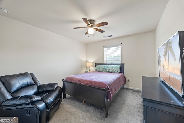 carpeted bedroom with baseboards and a ceiling fan