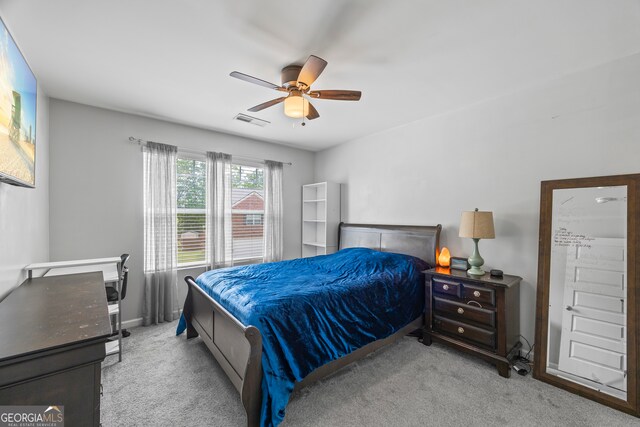 bedroom with carpet, a ceiling fan, and baseboards