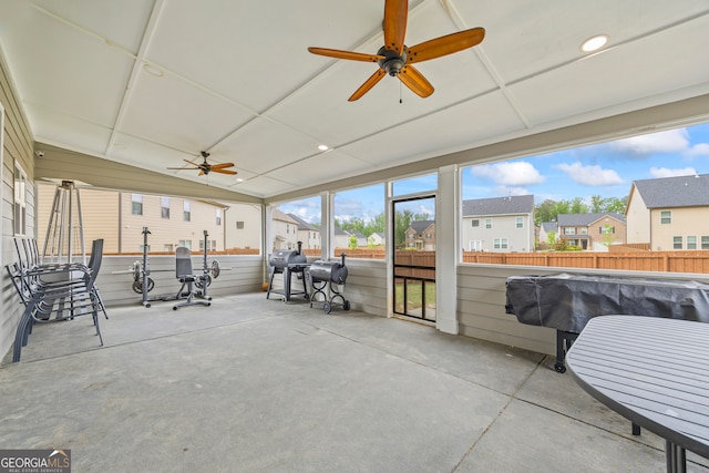 view of patio with a residential view, ceiling fan, and fence