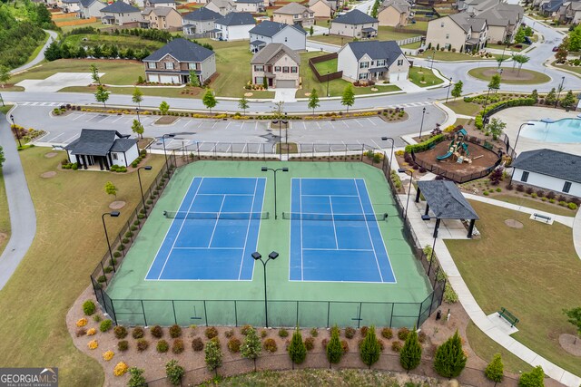 aerial view of residential area featuring a pool