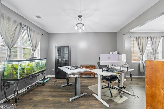 office area with plenty of natural light, wood finished floors, and baseboards