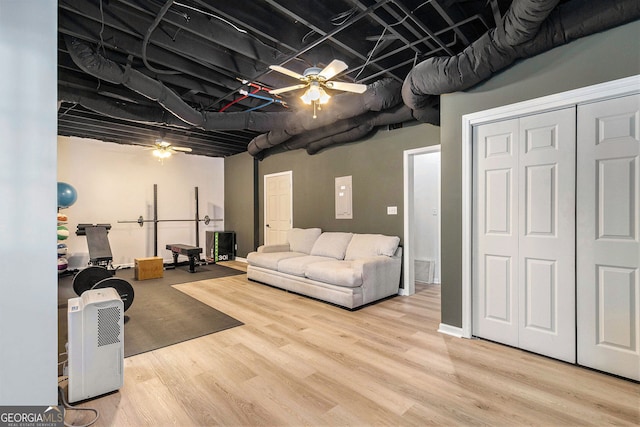living area featuring ceiling fan and wood finished floors
