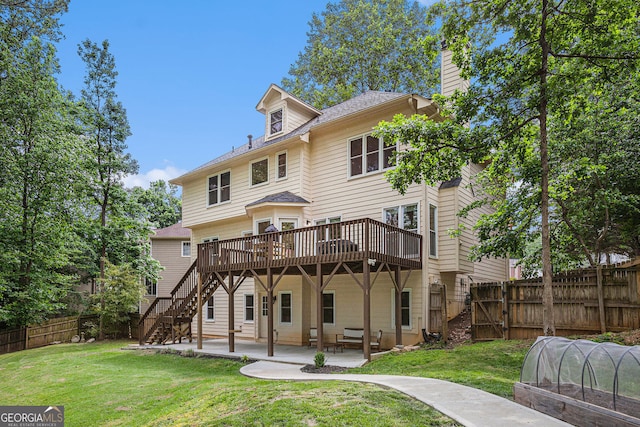 rear view of house with a wooden deck, stairs, a chimney, and a patio