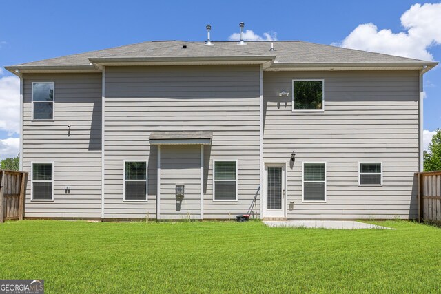 150 Gadson Dr, Fayetteville, GA 30214 - rear view of property with a yard and fence